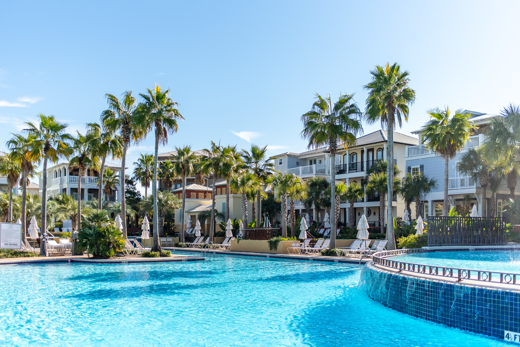 Seacrest Beach's beautiful 12,000sf pool surrounded by palm trees